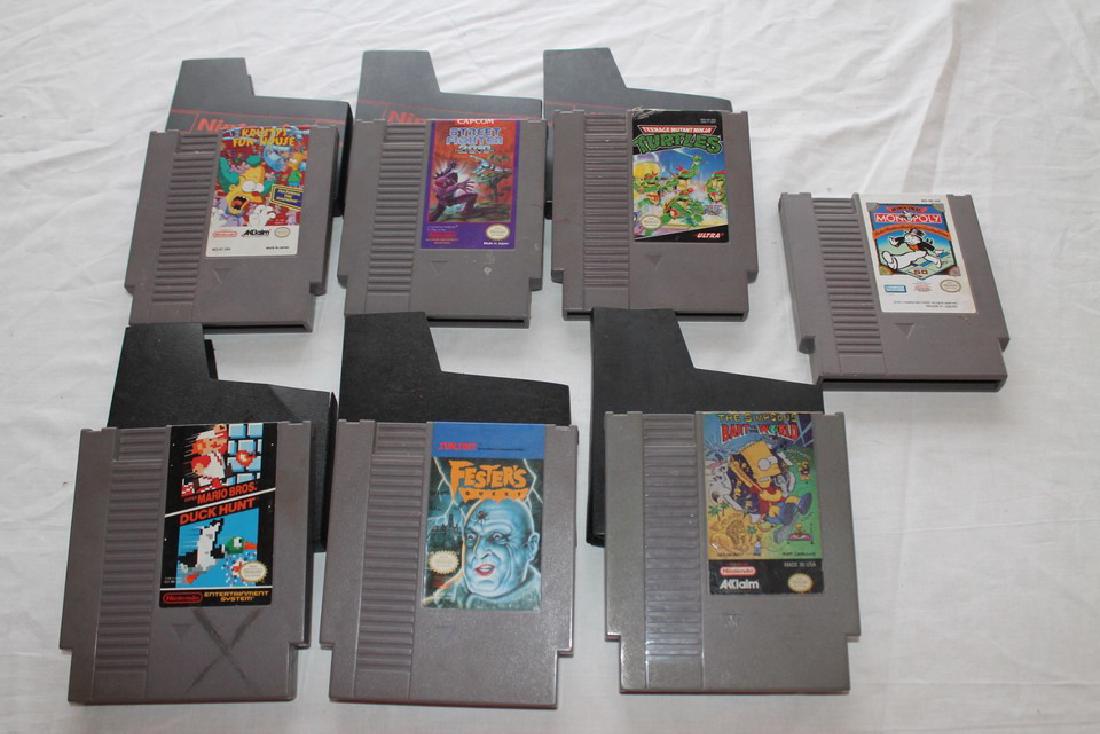 Lot of seven loose NES games: Bart Vs the World, Fester's quest, Mario Bros./Duck Hunt, Monopoly, Krusty's Fun House, and TMNT