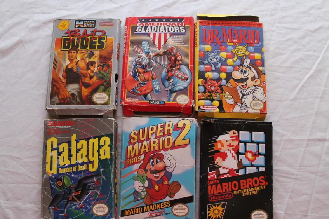 Lot of six boxed NES games: American Gladiators, Galaga, Rad Dudes, Dr Mario, Super Mario Bros, Super Mario Bros 2.
