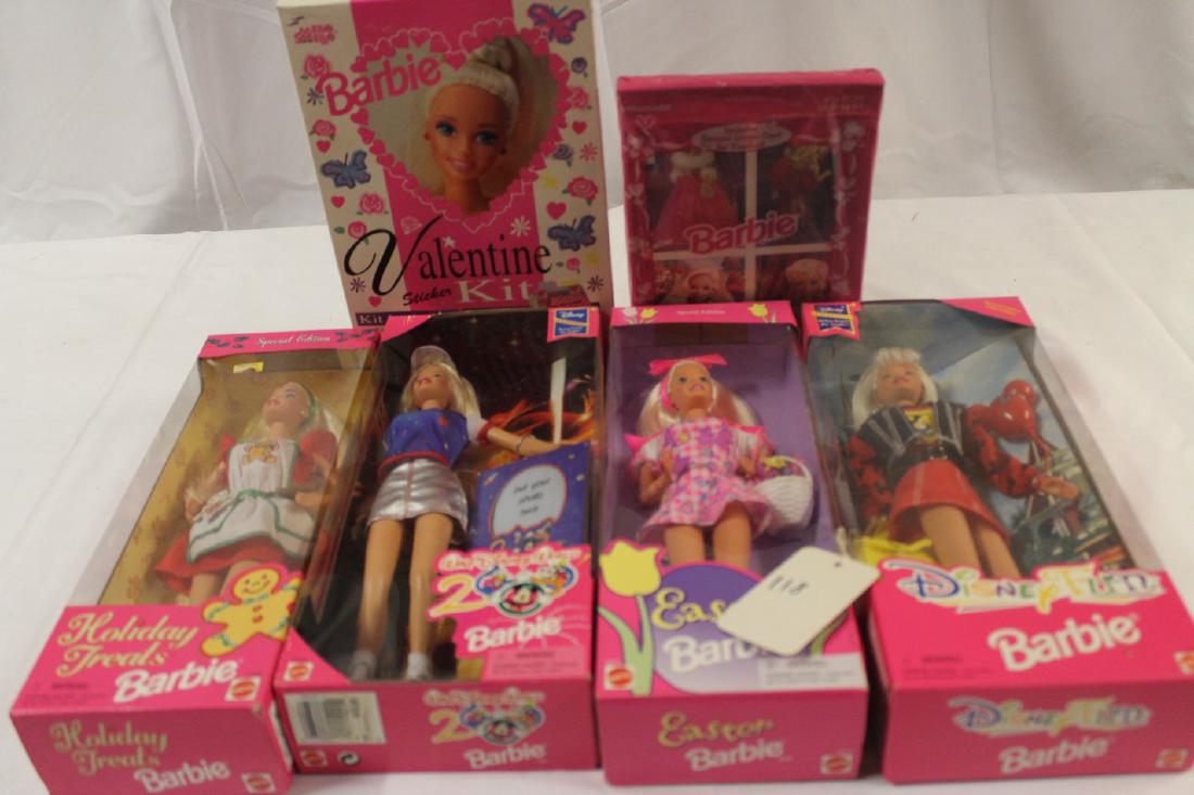 Lot of brand new-old-stock Barbie Dolls: Easter Barbie, Holiday Treats Barbie, Disney Fun Barbie, Wald Disney World 2000 Barbie, plus Barbie Valentines cards and stickers.