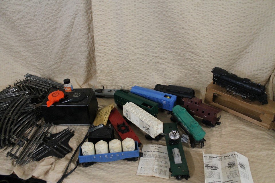 High end Lionel train lot: Old and new trains, Wells Fargo cop and robber train, giraffe train, satellite launcher train, ect