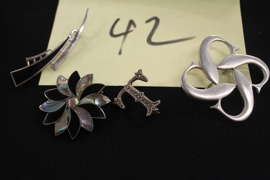 Four sterling pins (1 of 6)