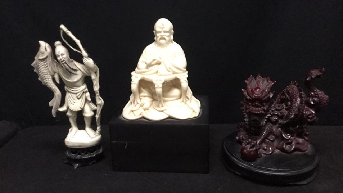 Three Asian figures (1 of 4)