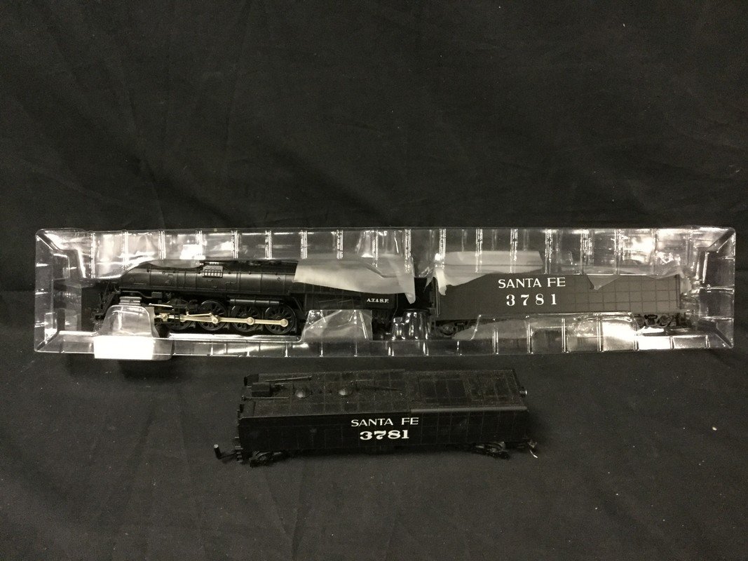 Bachmann HO Santa Fe 4-8-4 Northern steam locomotive: Bachmann HO Santa Fe 4-8-4 northern steam locomotive (DCC) 1940's-1950's #3781. Open box slightly soiled with rips and scuffs around the box.