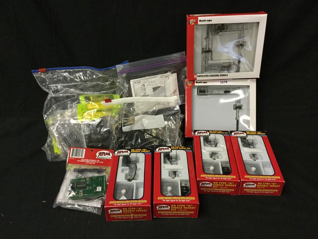 Four Atlas model railroad signs, two Walthers (1 of 3)