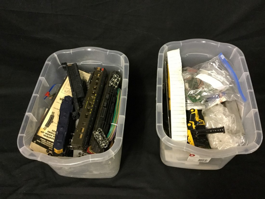 Two plastic tubs of assorted train parts (1 of 2)
