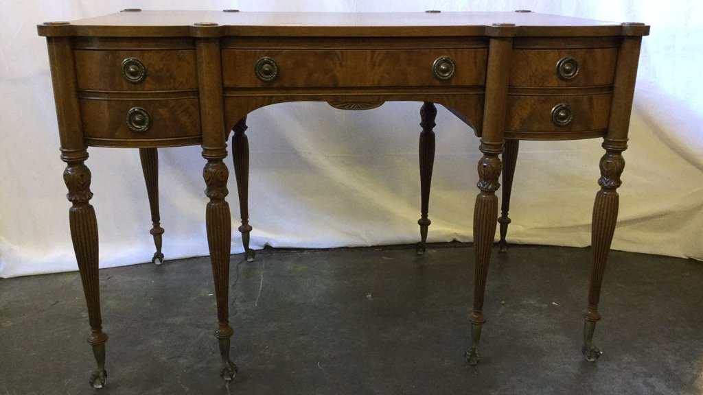 1900's American Burl Mahogany Desk: 1900's American Burl Mahogany Desk. Claw and Ball feet. Glass balls. Appx. 31.5" H x 48" W x 28" D.