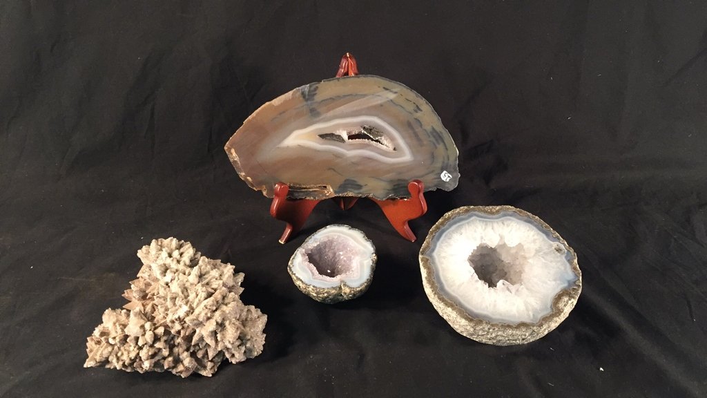 Lot of Geodes and Specimens: Lot of Geodes and Specimens (4) pieces. Largest geode (furthest to right in photo) appx 5.5" diameter.
