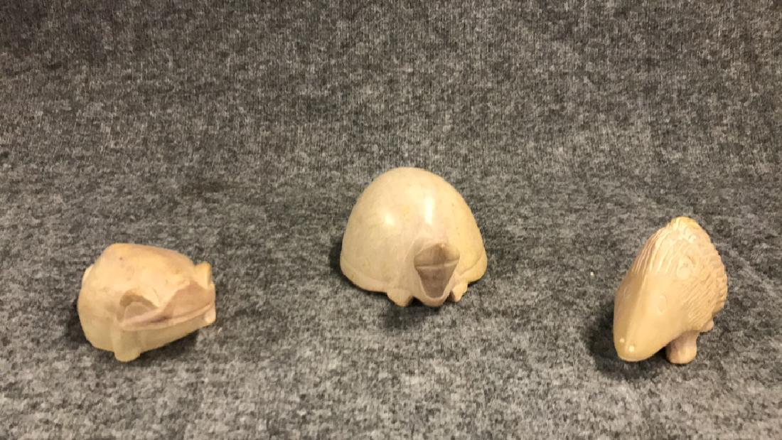 Three carved soapstone animals: Three carved soapstone animals Hedgehog 6" long Turtle 8" long 5.5"