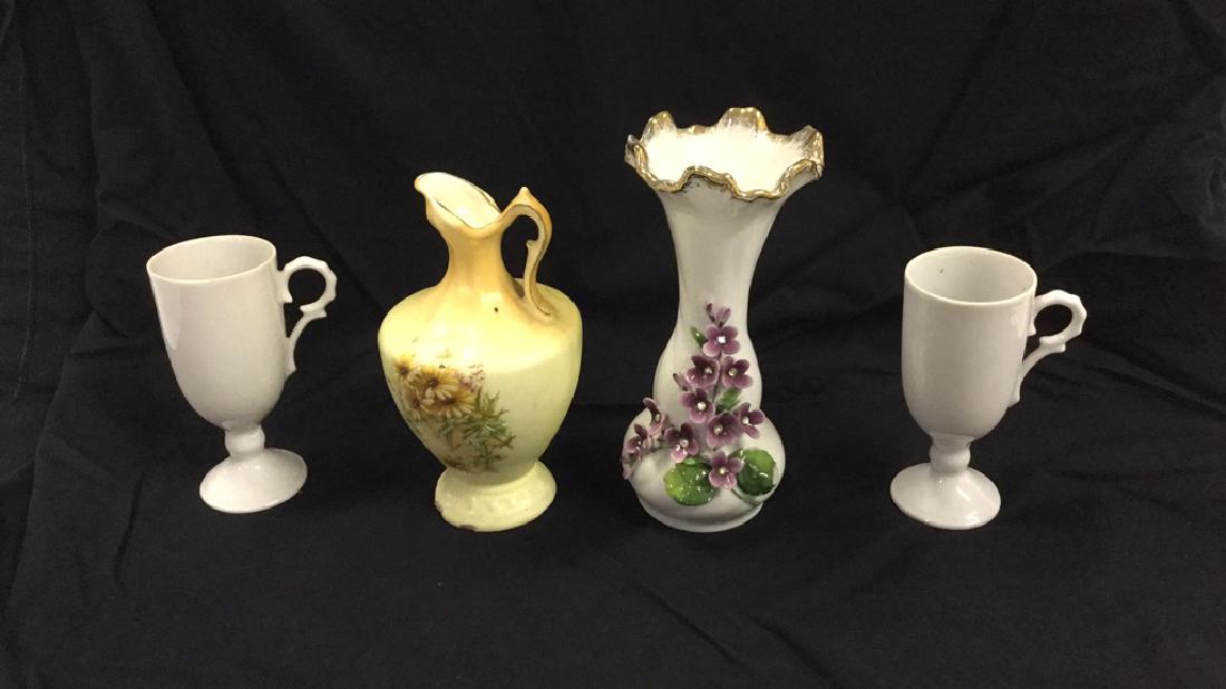Two flower vases and two cups (1 of 2)
