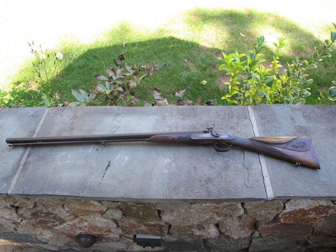 19TH CENTURY ENGLISH FOWLER ORNATELY CARVED STOCK: A nice example of a 19th Century English Fowler. No visible maker's mark. It has a hand carved maple stock. It has been professionally estimated to be from1860 to 1890. It is double barreled and comes