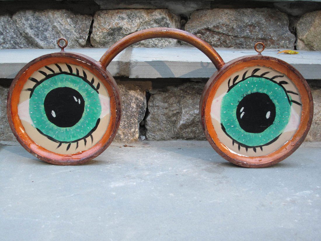 ANTIQUE EYEGLASS SIGN REVERSE PAINTED GLASS FOLK ART: An awesome piece of folk art! A painted iron (or steel) pair of eyeglasses with reverse painted glass eyes on both sides. Measures approximately 23" wide and 10 1/2" high at the top of the bridge with