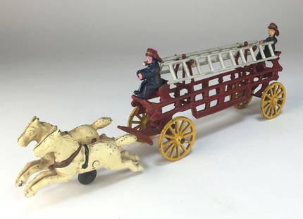 Antique Dent Cast Iron Toy Two-Horse and Two-Ladder: Two white horses in full gallop pull a pair of firefighters and their ladder-carrying wagon to the fire. Made by the Dent Hardware Co. in Pennsylvania around the turn of the last century, this cast