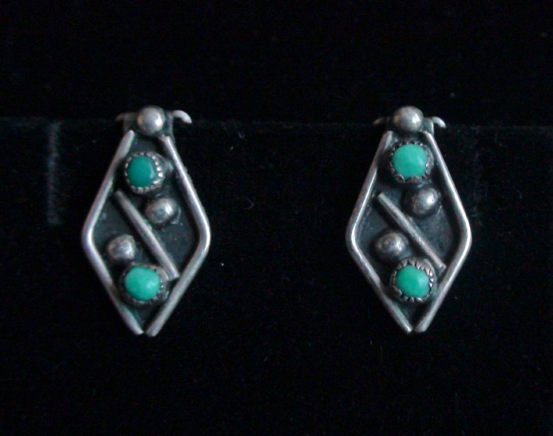 Antique Native American Zuni Sterling Silver Petite: Here are a fantastic pair of Antique Native American Zuni Sterling Silver with Petite Point Turquoise Stones Clip On Earrings. They measure 3/4 inch long X 1/3 inch wide. They each have 2 beautiful bl