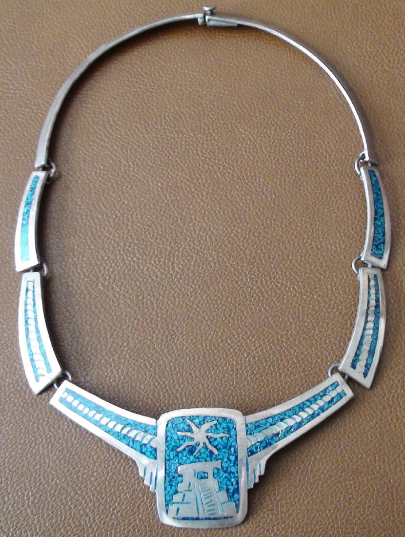 Mid Century Taxco Sterling Silver Lapis Inlay Necklace: Here is an awesome Mid Century Taxco Sterling Silver with Lapis Chip Inlay Choker Necklace. It has a locking clasp that functions perfect. The main pendant has a mayan temple design in silver surround
