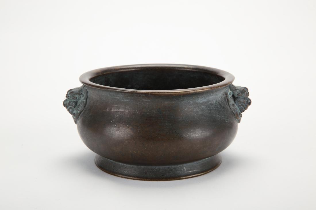 A Chinese Bronze Incense Burner with Foo-Dog-Head Ears: Diam. 15cm Ht. 8cm