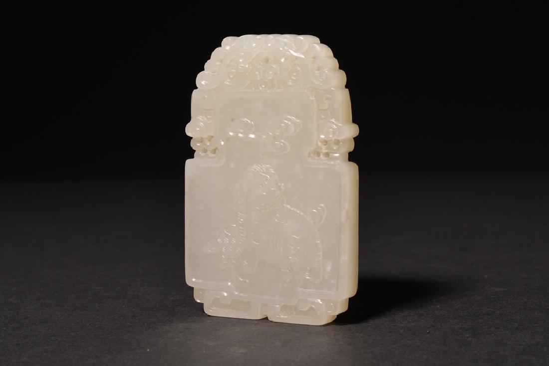 A CARVED WHITE JADE PENDANT , Qing Dynasty (1 of 4)
