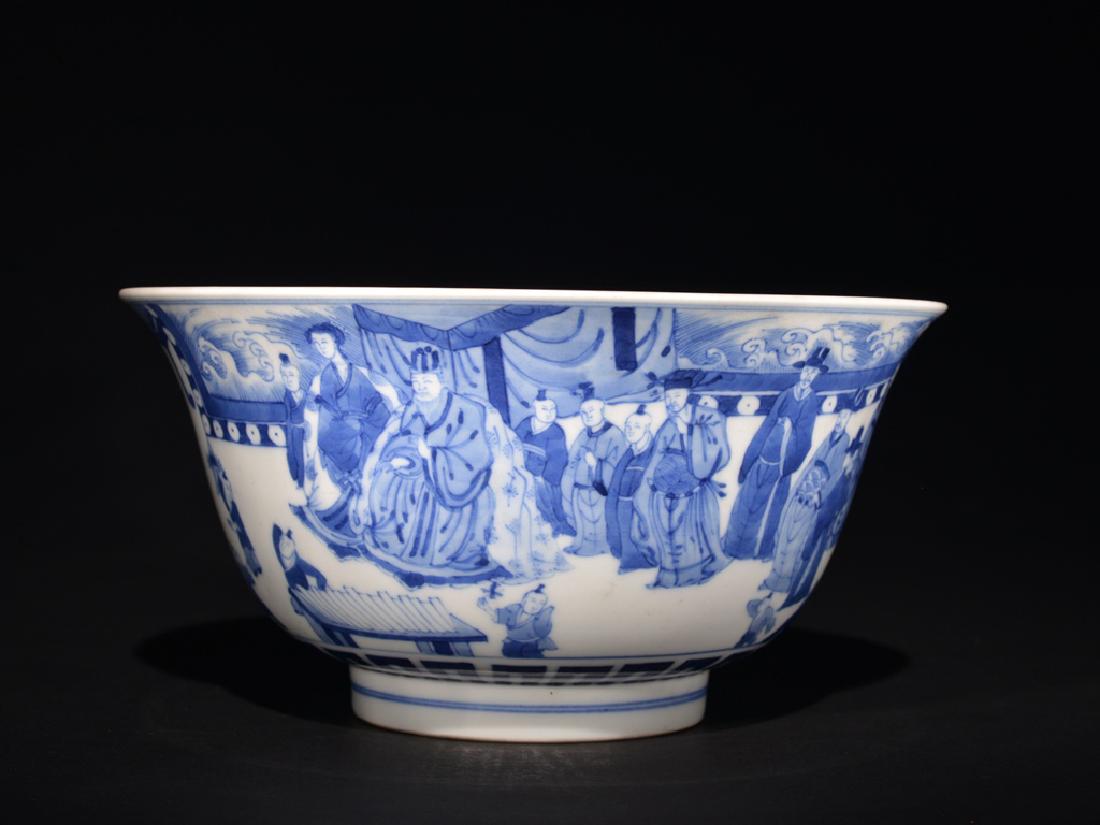 A BLUE AND WHITE BOWL , Ming Dynasty: The bowl is concave-shaped and the exterior is decorated with numerous villagers socializing. There are six Chinese characters on the base. Size: 4 in. (10.2 cm) tall, 7 7/8 in. (20 cm) diameter.