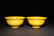 A PAIR OF CARVED YELLOW -GLAZED DRAGON BOWLS