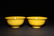 A PAIR OF CARVED YELLOW -GLAZED DRAGON BOWLS - 2