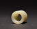 A CARVED WHITE JADE ARCHERS THUMB RING - 5