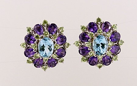 SILVER EARRING WITH BLUE TOPAZ, AMETHYST AND PERIDOT: EARRING STERLING SILVER STONE BLUE TOPAZ, AMETHYST, PERIDOT FINISH POLISHED WEIGHT 10.00 CTS WEIGHT 13.00 GMS SHAPE OV LENGTH 1" COLOR BLUE, PURPLE AND GREEN