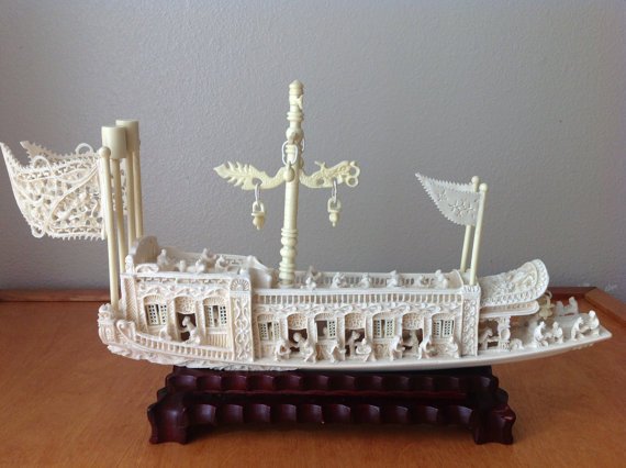 Chinese Faux Ivory Tusk Boat Qing Dynasty: This fantastic boat is ready to add to your collection. It is a pleasure boat model depicting life in the 19th Century, Qing Dynasty. Intricately carved in the form of a two tiered boat screened rooms