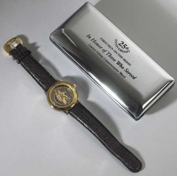 1969. 25th Anniversary of First Man on the Moon wa: 1969. 25th Anniversary of First Man on the Moon watch Gold plated limited edition watch authorised by Buzz Aldrin, from the 1969 Apollo moon landing crew. Also with this lot a novel by Buzz Aldrin, Th