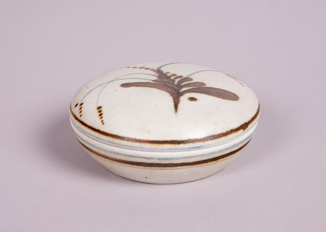 David Leach OBE (British, 1911-2005): Title: POWDER BOX WITH LID Size 1.50 by 3.50 by 3.50in. (3.8 by 8.9 by 8.9cm) Condition Excellent condition. Medium porcelain Signature signed with monogram on unders