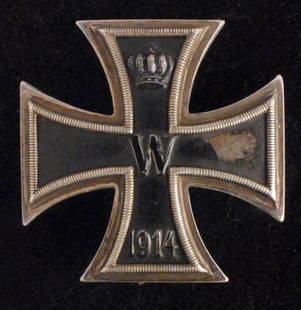 1914 Iron Cross 1st class.: Convex type with vertical pin and catch. Paint loss to the right arm of the cross and minor point damage. Used condition.