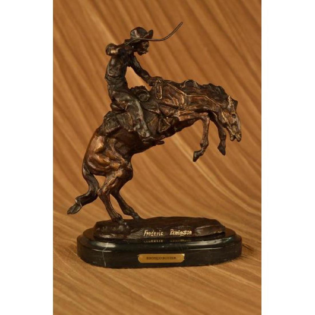 Bronco Buster White Bronze Sculpture on marble base: A Great American Classic, This Statue Is Of A Cowboy On Horse Moving Fast Through The Wild Wild West! The Horse Is Standing High On His Hind Legs Ready To Gallop With Some Serious Speed. The Cowboy Is