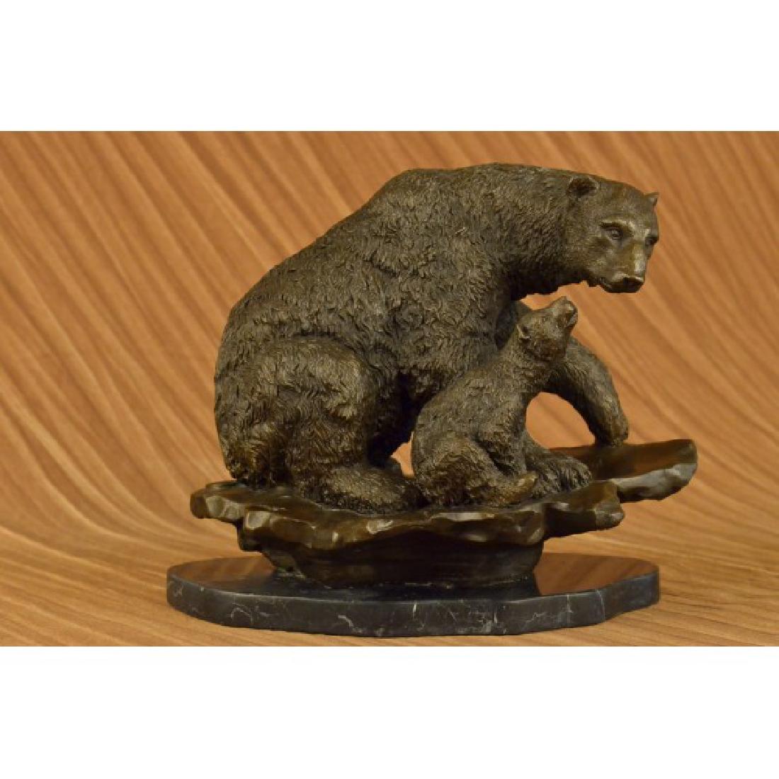 Bear with Cub Bronze Sculpture on marble base Figurine: A cub stares up at his mother bear in this sculpture depicting the tender relationship between a mother and her cub. Mama bear is the protector; she feeds and guides her cub to grow strong and brave l