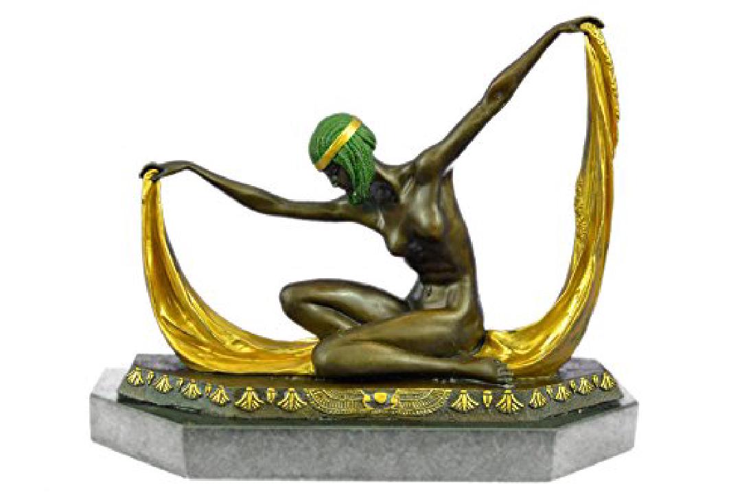 Graceful Nude Dancer Bronze sculpture on Marble base: With Extreme Grace And Expertise This Dancer Strikes Her Beginning Pose. She Bows Her Head And Holds A Long Yellow Sash, That Stretches From Arm To Arm. She Sits On The Soles Of Her Feet, Folding Her 