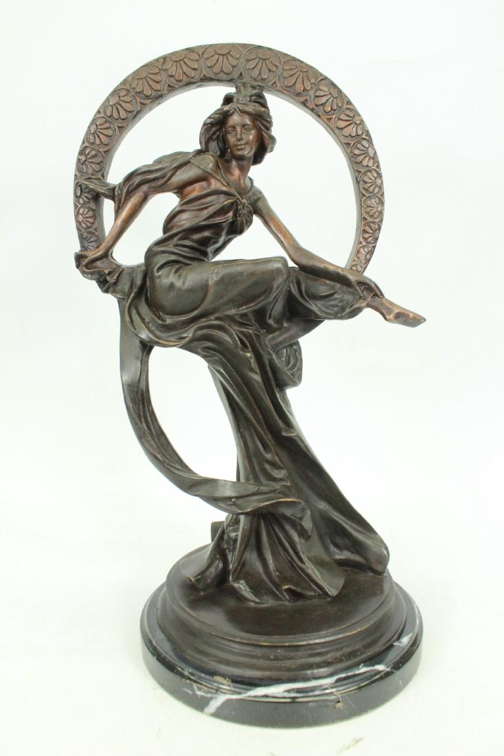 Dream Goddess with Bliss Ring Bronze on Marble Base: This dream goddess sits in a ring of bliss that is filled with a loving warm energy. Her beautifully long dress wanders away in the wind, almost as if it is doing a small dance to the dreams of the ni