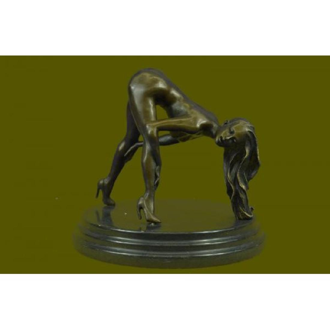 Signed Original Mavchi Nude Girl Bronze Sculpture: The nude seductress lies on the ground in the grasp of a feverish desire. The bronze sculpture, capturing woman sexuality, was cast using the early method of lost-wax casting and stained with a brown 