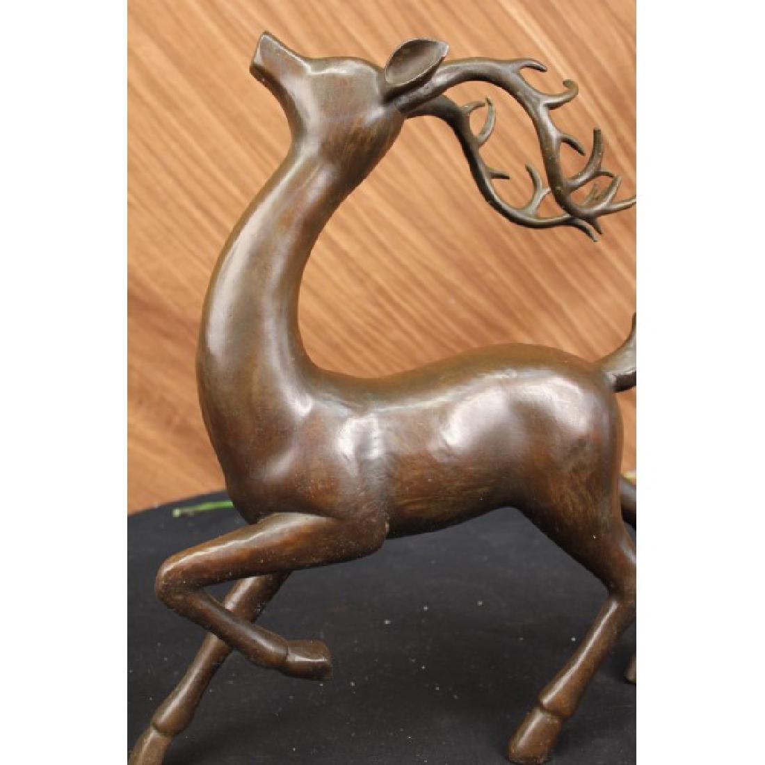 Deer Buck Bronze Statue Hunter Vanderveen Art: The male deer comes down the forest's edge offering a series ofvocalizations for the mountains to echo across the sky and lands. Heseems as though he is on a mission to find a mate. His crown of talla