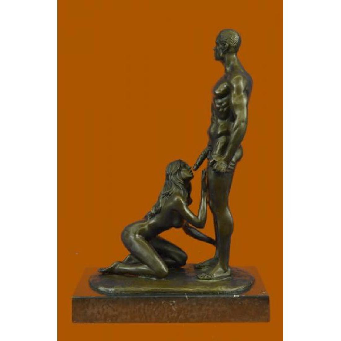 Signed Original Mavchi Oral Pleasure Masterpiece Bronze: This Erotic Sculpture Is An Exquisite Piece Of A Interracial Couple In A Very Evocative Pose. The Female Is Sensually taking care of her man by giving him Oral Pleasure. He Grabs His underwear While H
