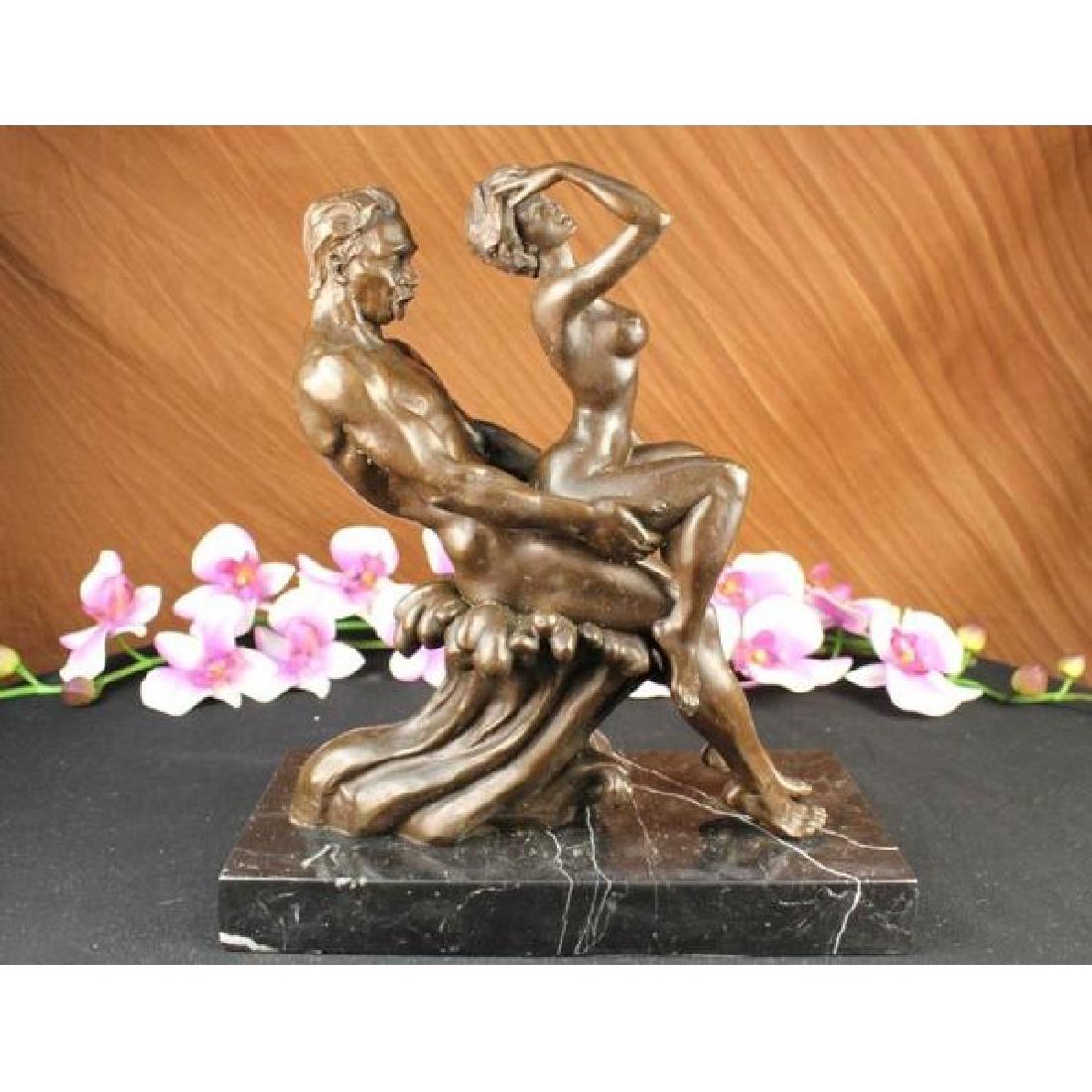 Signed Couple Making Love Bronze Sculpture Marble Art: This erotic sculpture is an exquisite piece of a interracial couple in a very evocative pose. The female is sensually touching the front of her hair as she sits on top of her African American lover. H