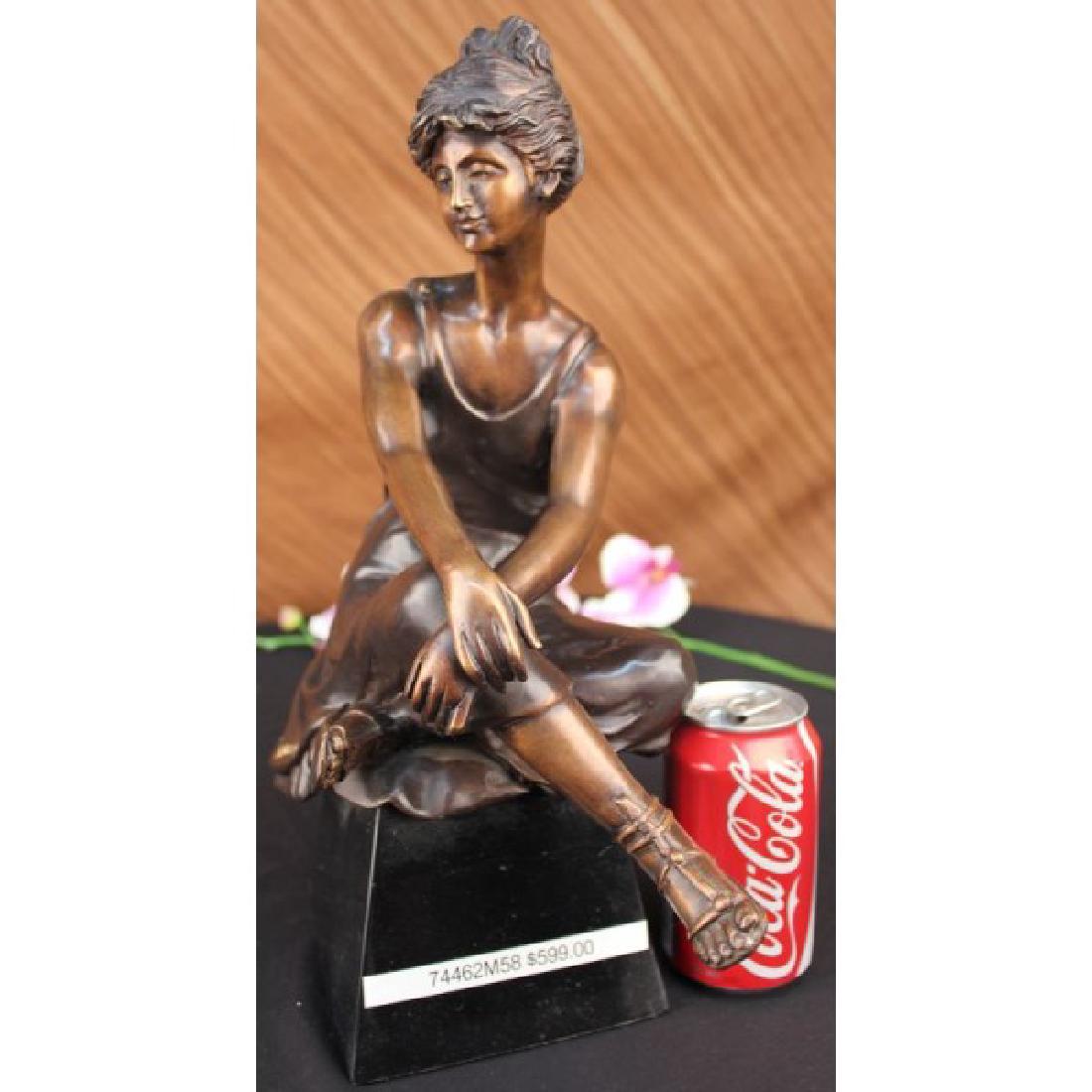 Vintage Seductive Lady By Moreau Bronze Sculpture: She is an artist's muse. She poses for a painting, sitting before hiseasel. She is perched on a sheet, which is spread across a bench. Shehikes a knee up and gently cradles it under her arm. Her long