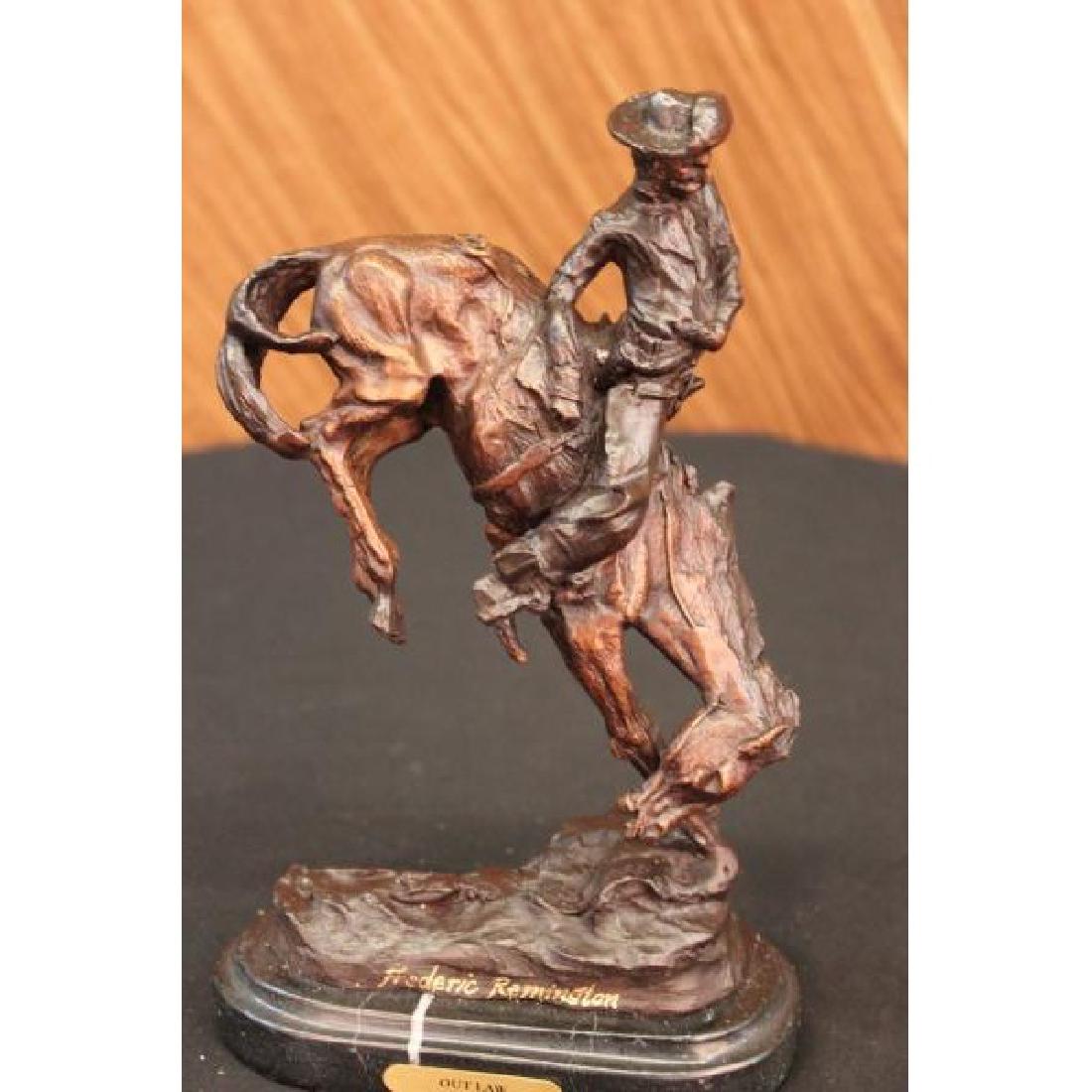 Cowboy on Horse Rodeo Old West Western Bronze Sculpture: A seasoned trooper cowboy is casually patrolling the area. He and his loyal horse gallop through the open dry plains. He is dressed in a shirt,chaps and boots, giving him the look of a good ole fashio