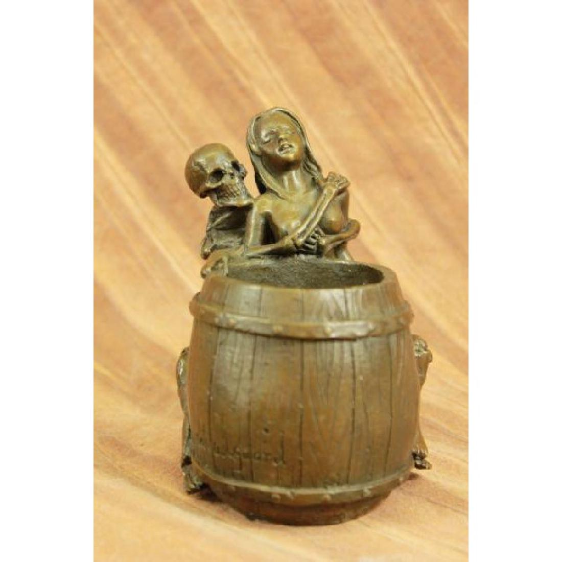 Erotic Skeleton Holding Tightly to a Nude Female Bronze: Skeleton holding a nude nymph pen Holder, Cool, Unusual and Creepy item for the morbid of taste. Made to last with pure bronze, bottom covered with felt. In excellent condition. This Bronze Sculpture