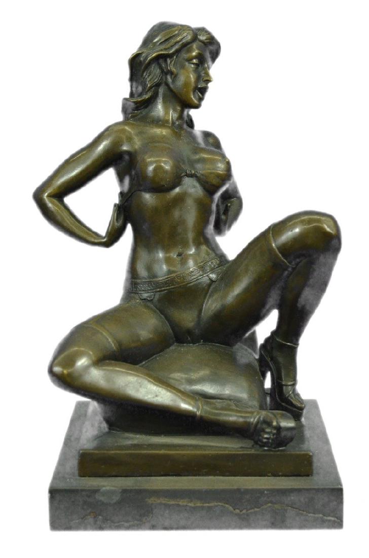 Erotic Nude Woman Bronze Statue: This highly erotic sculpture features a nude female in a very evocative pose exposing all of her body parts. She wears high heels while she is seated on a toilet in the midst of (I leave it to your im
