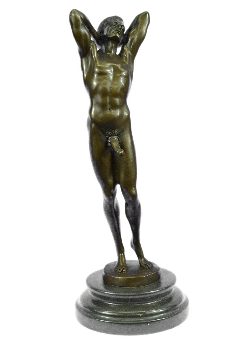 Gay Art Nude Male Bronze Statue on Marble Base: He boldly stands in the buff with a look of fearless determination.This proud gay man stretches his muscular arms behind his head and poses for his admirers. Proving he knows no shame he showcases how