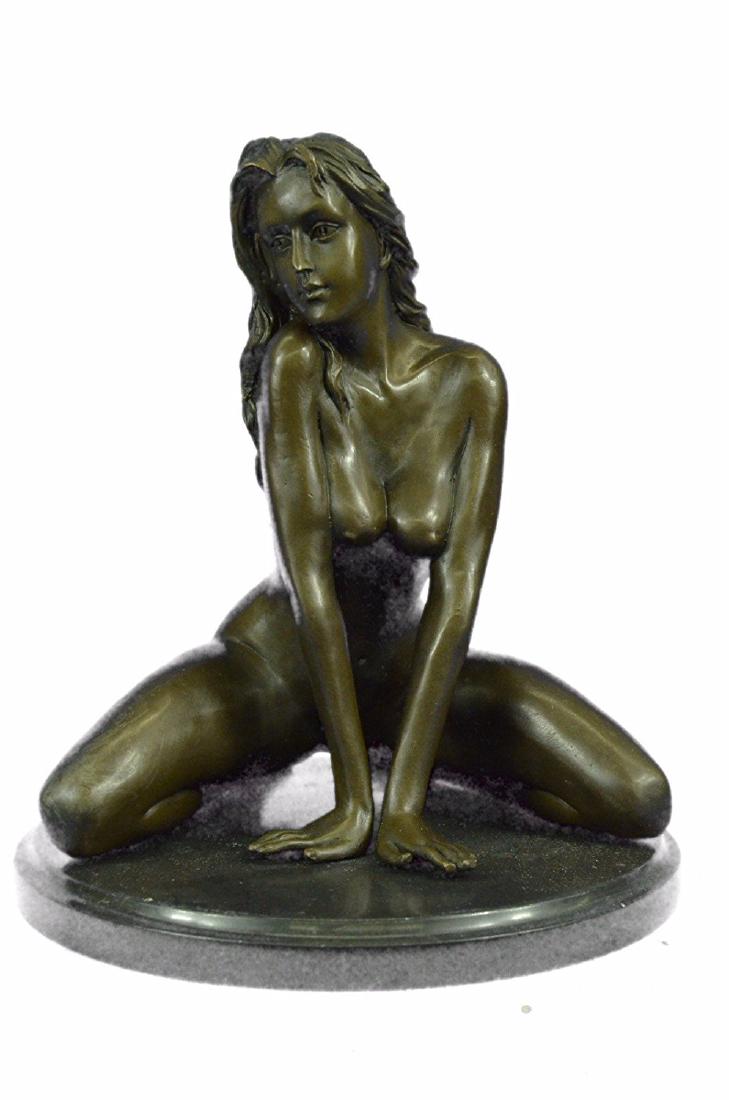 Nude Female Bronze Sculpture on Marble Base Statue: She kneels down and sits on her heels as if she is dancing to a song. Her hair falls down do her back and her face is one of ease and pleasure. She shakes her bracelets to the music and enjoys the sou