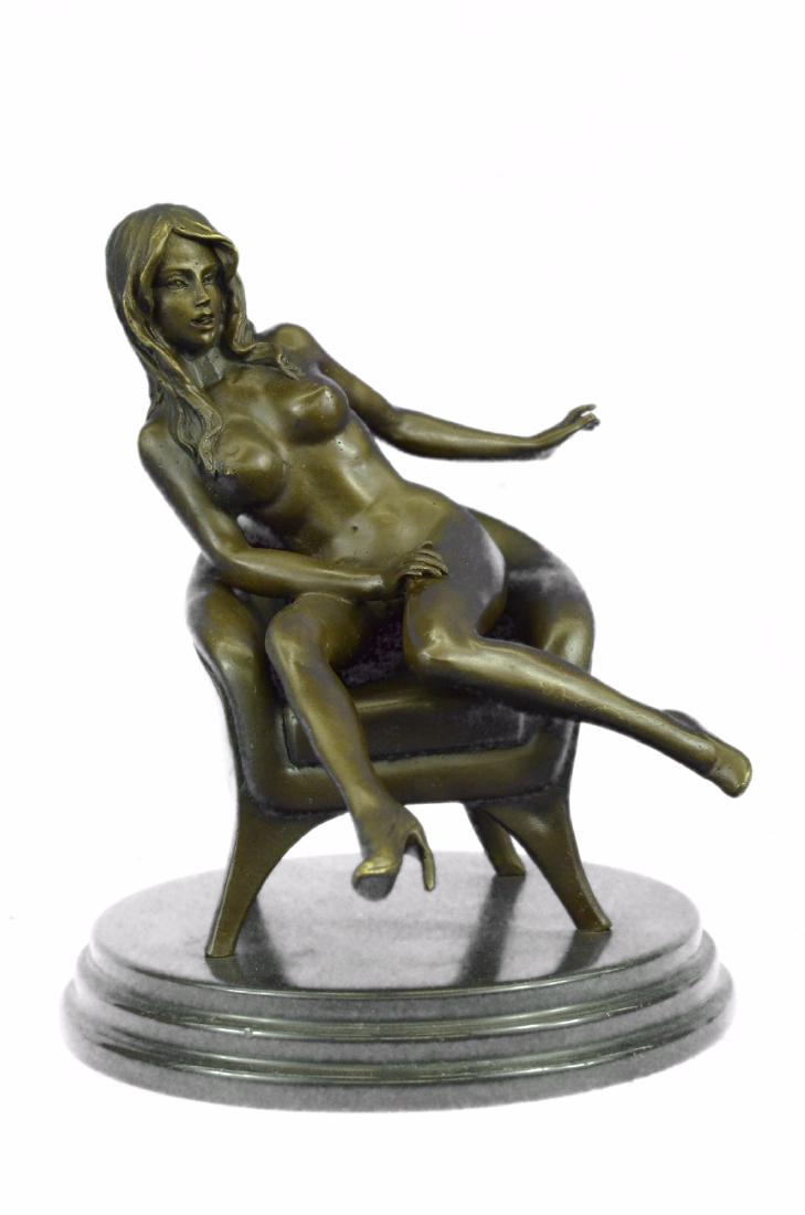 Erotic Nude Sexy Girl Explicit Chair Pose Bronze Statue: She sits side saddled on a sofa as the wind blows through her hair. She wears nothing and completely naked. Her breasts are exposed and her nipples are hard and pointy letting you know she is defiantl