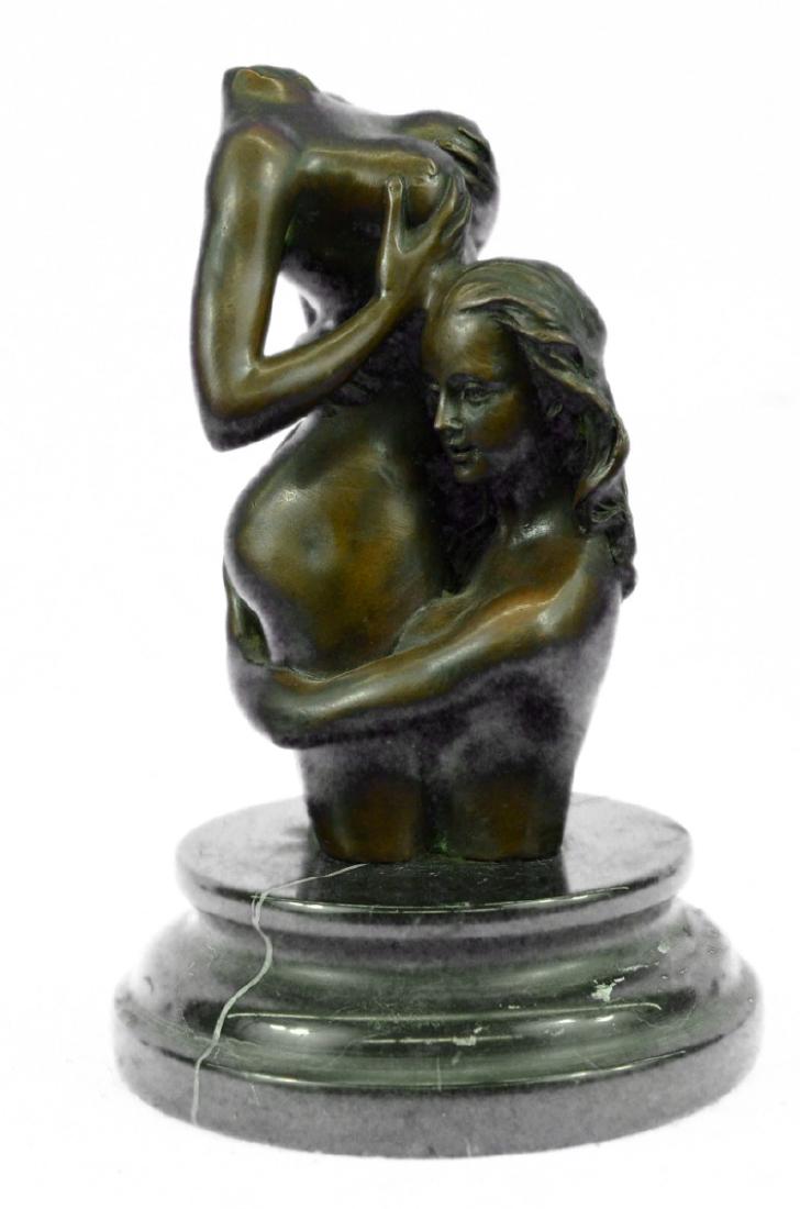Bust of Naked Girls Bronze Sculpture: This is a sexy halfbust sculpture. This sensuous sculpture depictstwo naked girl in an erotic embrace. One woman clutches herlovers curvy body, cradling her butt tightly. She hugs her nude bodyclose t