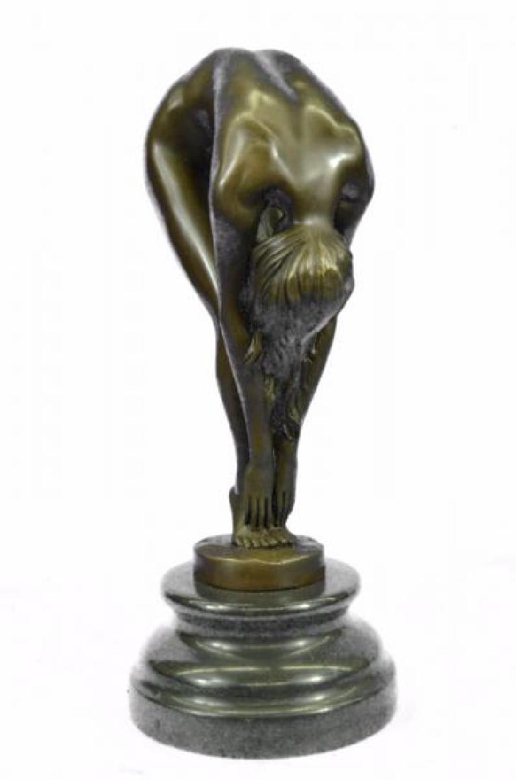 Erotic Sensual Nude Female Woman Bronze Statue: The beautiful nude, with flexibility, throws her arms to the ground, her hair cascading down, while her legs slightly bent on tiptoes. She she seems to stretch her sensuality from head to toes in a se