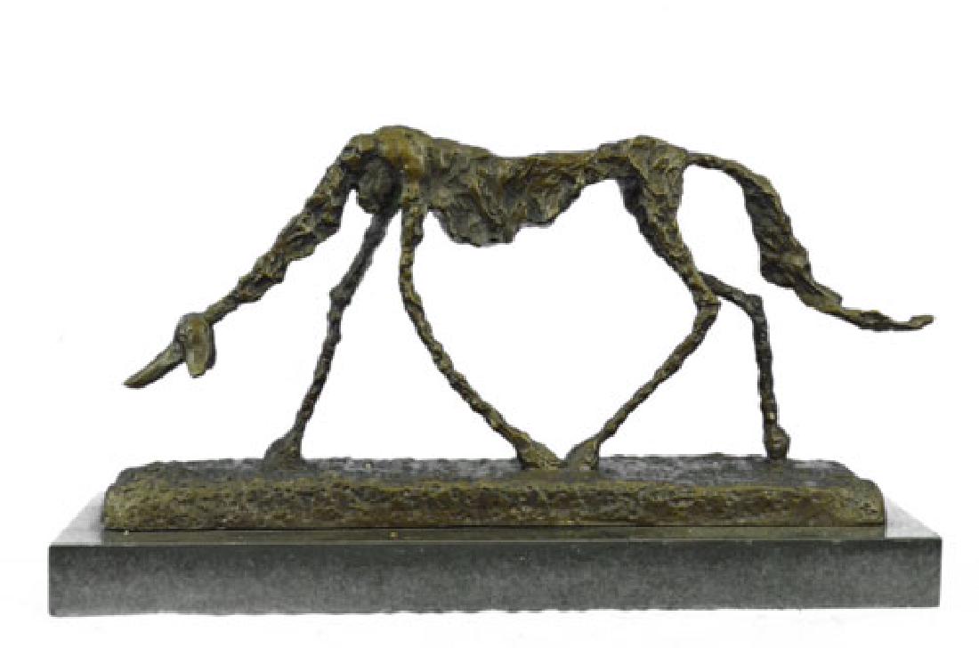 Alberto Gia cometti. Hand Made Bronze Sculpture: Alberto Gia cometti- the famous surrealist sculptor- made a sculpture of a Saluki dog in 1951. It was simply entitled: "Dog". Yet the model itself is not as simple as one would believe. Many dog resea