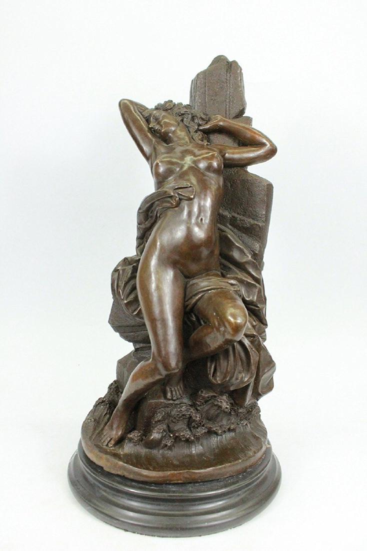 Nude Model posing for Camera Bronze Sculpture: This gorgeous Sculpture of a woman posing for the camera is astonishing. she leans back on a pillar of some sort and lets her body do the talking. She looks amazing as she stay still with her right ar