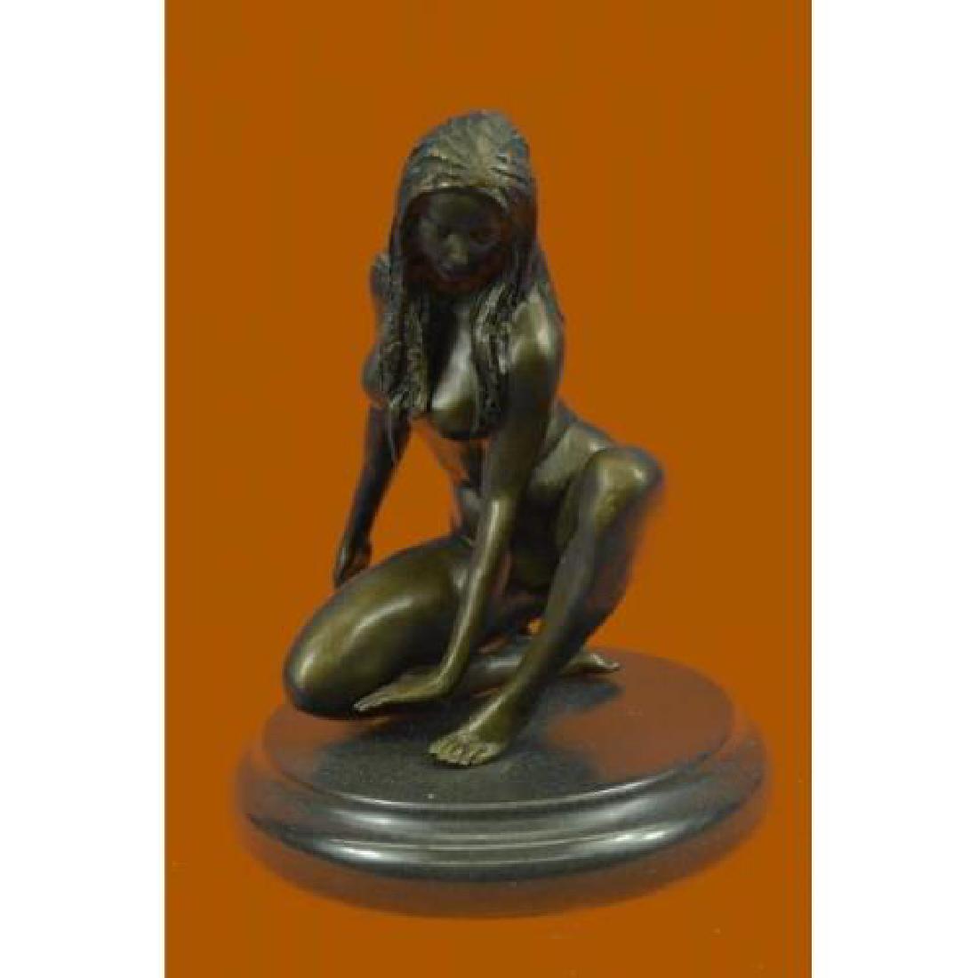 Nude Girl Bronze Figurine: This pose of a peaceful girl sitting with downcast eyes captures the true rebirth of the innocence age. The artist was able to depict elegant nudity that even supersedes the renaissance time. Bronze D