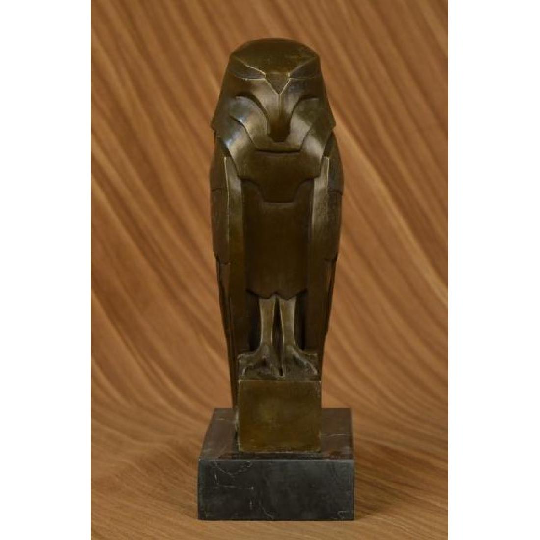 Abstract Modern Art Owl Bronze Sculpture on Marble Base: A quaint owl rests upon his perch, looking out into the night sky. His innate ability to listen keeps him occupied as he listens to the sounds of the night, waiting to hear the scurry of a mouse so th